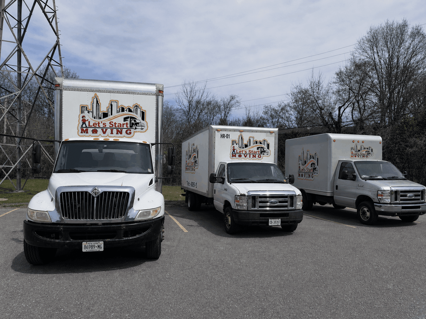 Another Let's Start Moving box truck showcasing company branding.